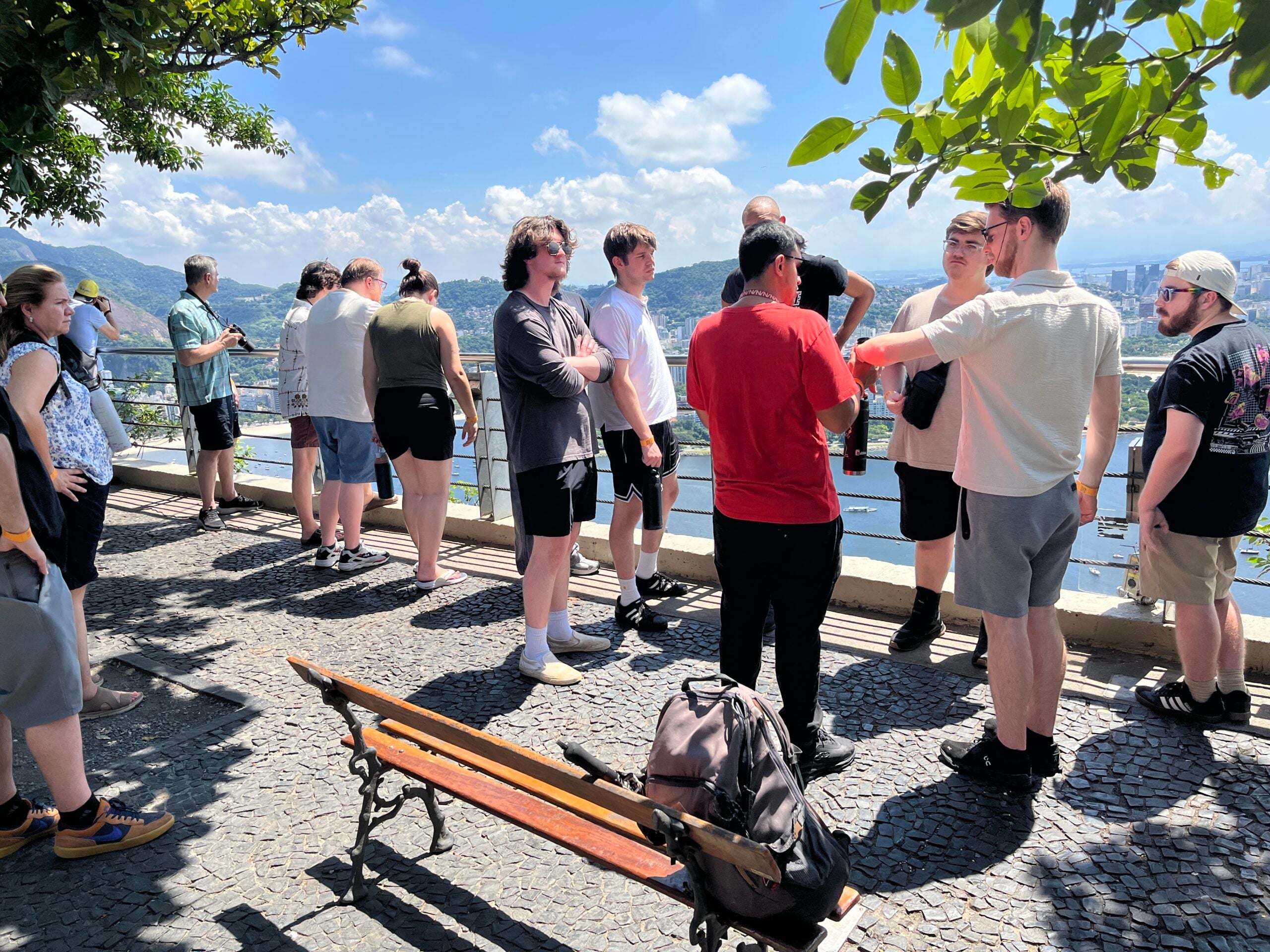 Students enjoying a sightseeing break at Sugarloaf Mountain during their educational music tour in Rio de Janeiro