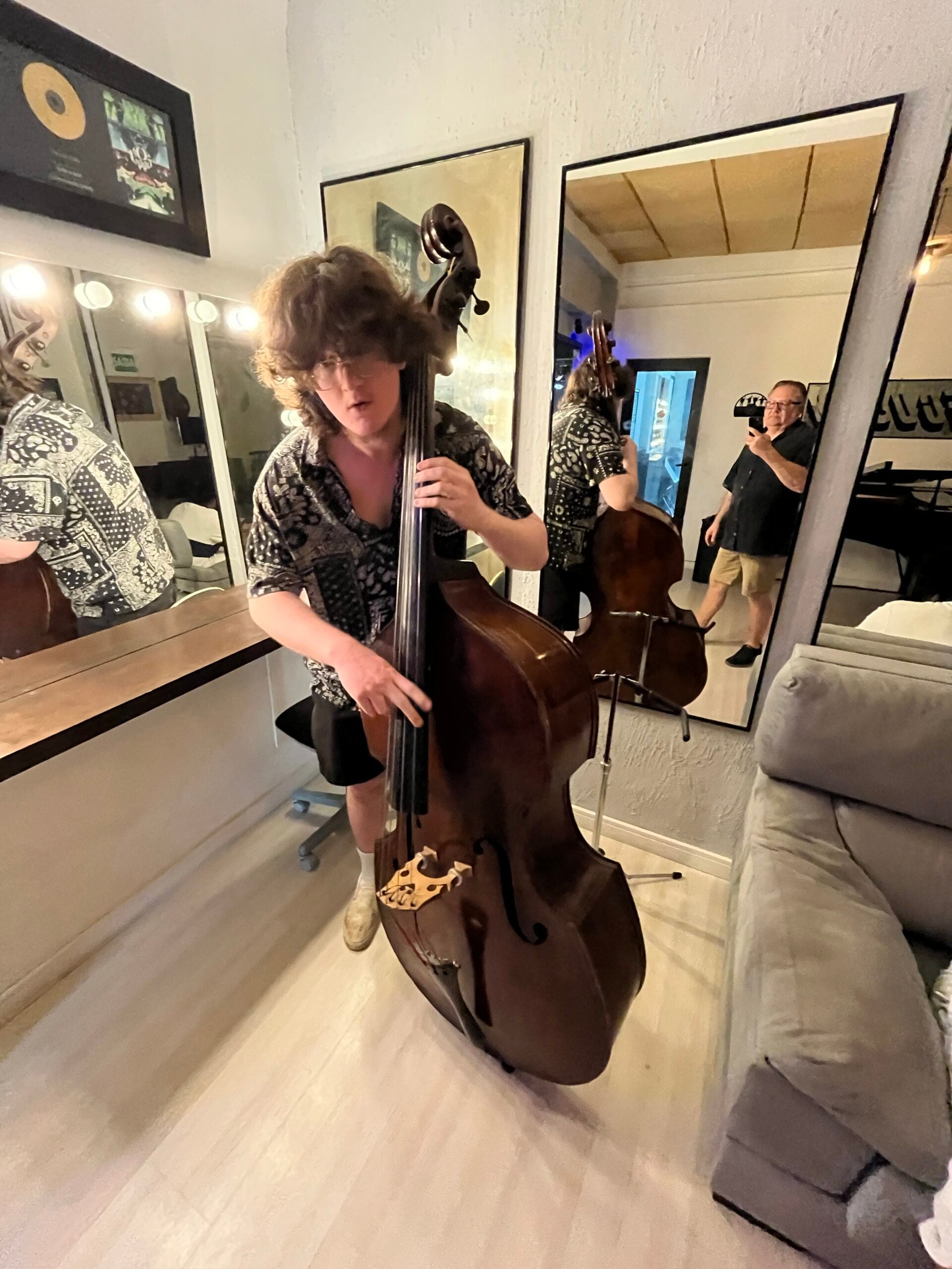 Student bassist rehearsing during an educational music program in Rio de Janeiro