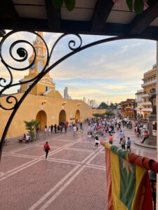Cartagena Clock Tower plaza and evening crowds at sunset
