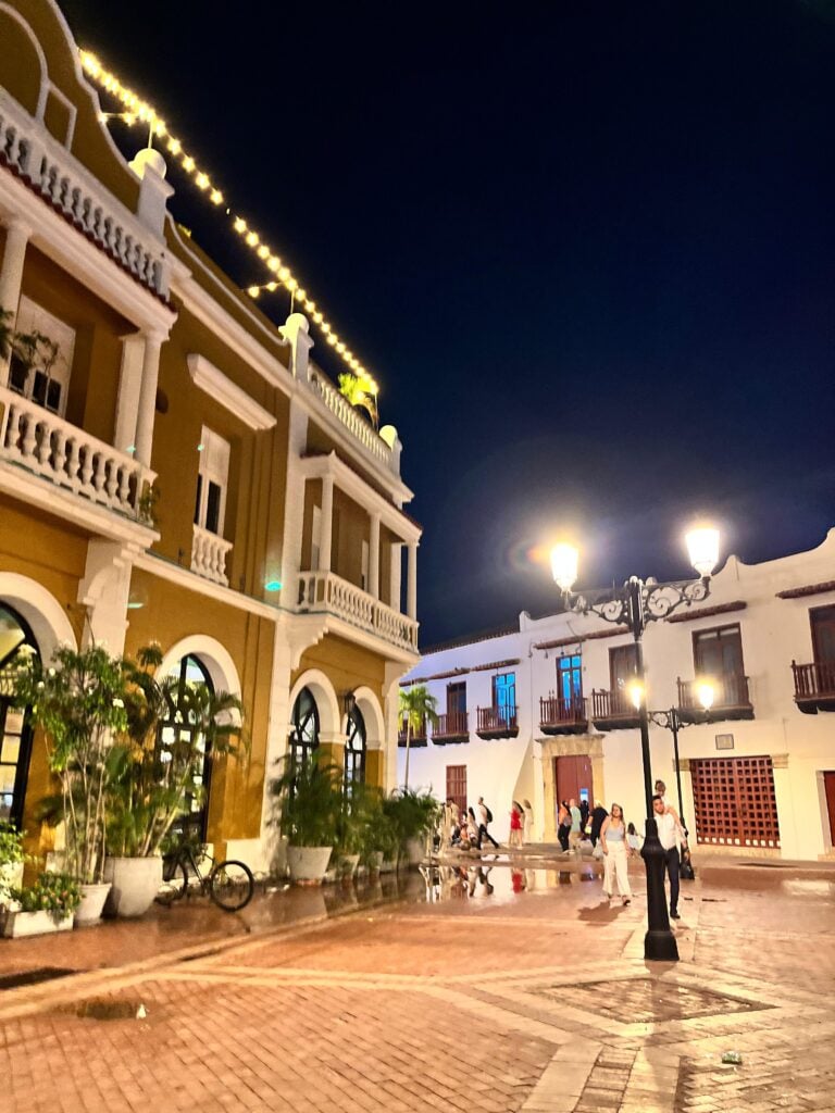 Illuminated colonial buildings and balconies in Cartagena's walled city at night