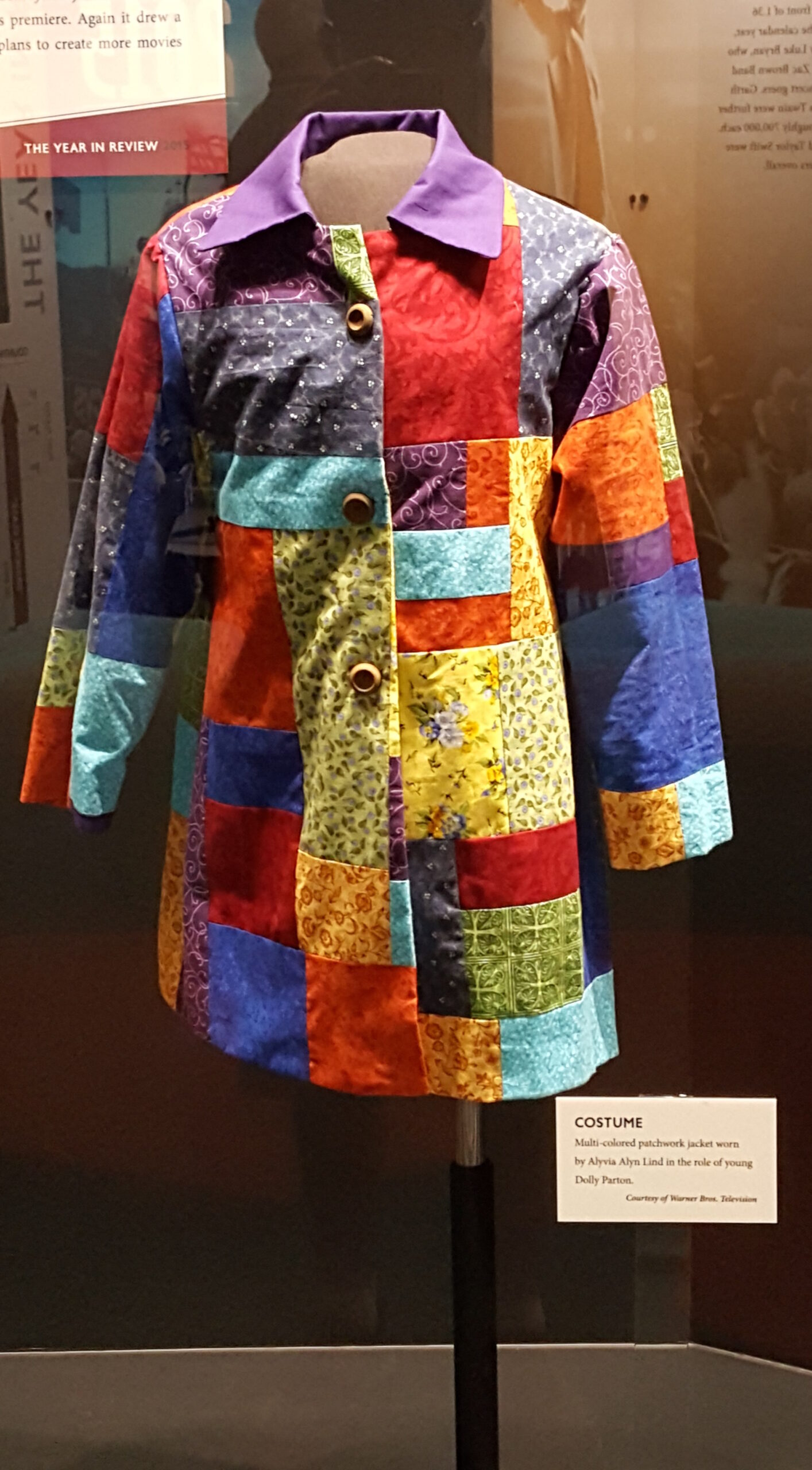 A multicolored patchwork coat associated with Dolly Parton's Coat of Many Colors on display in Nashville