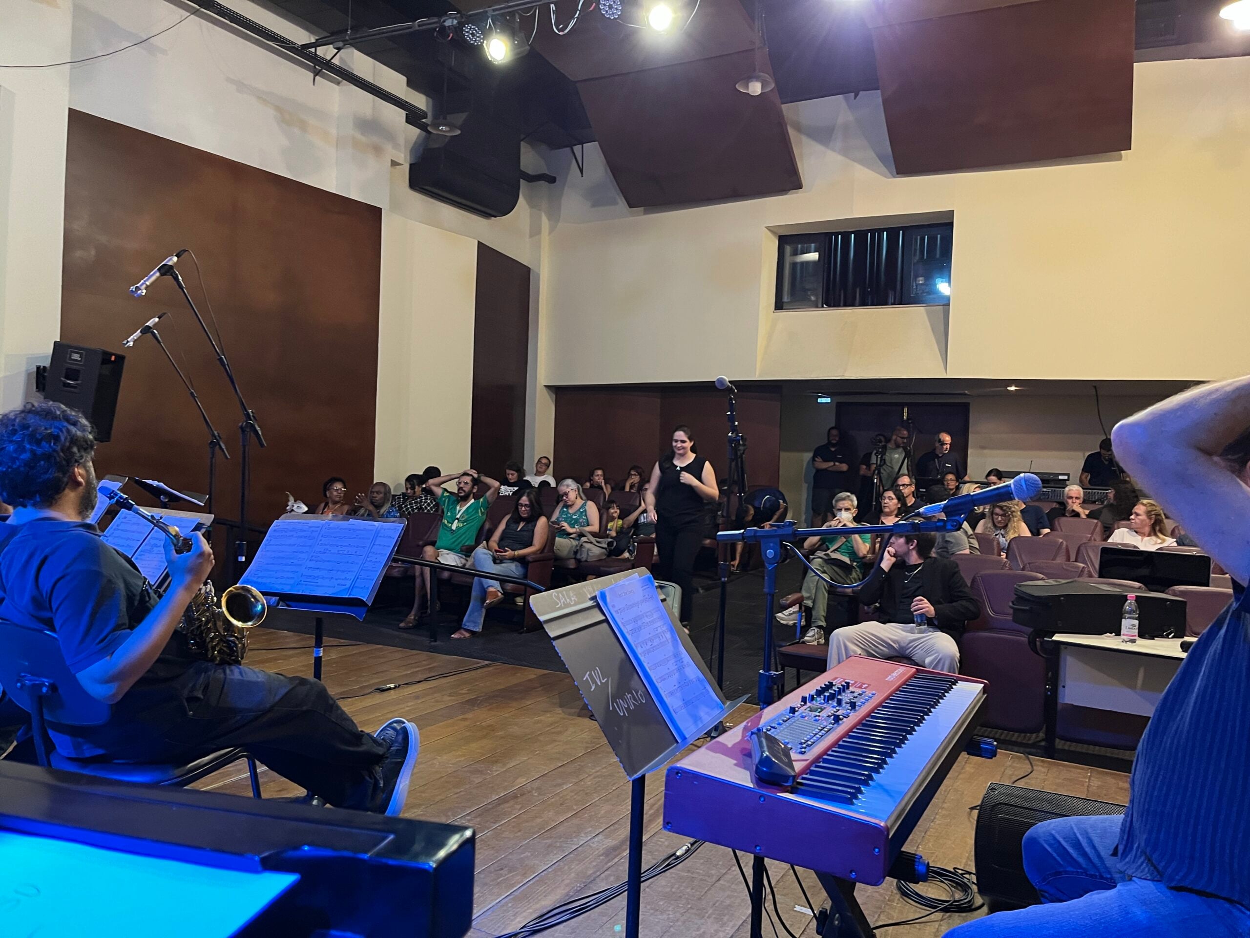 Musicians preparing repertoire and discussing arrangements during an educational exchange in Rio