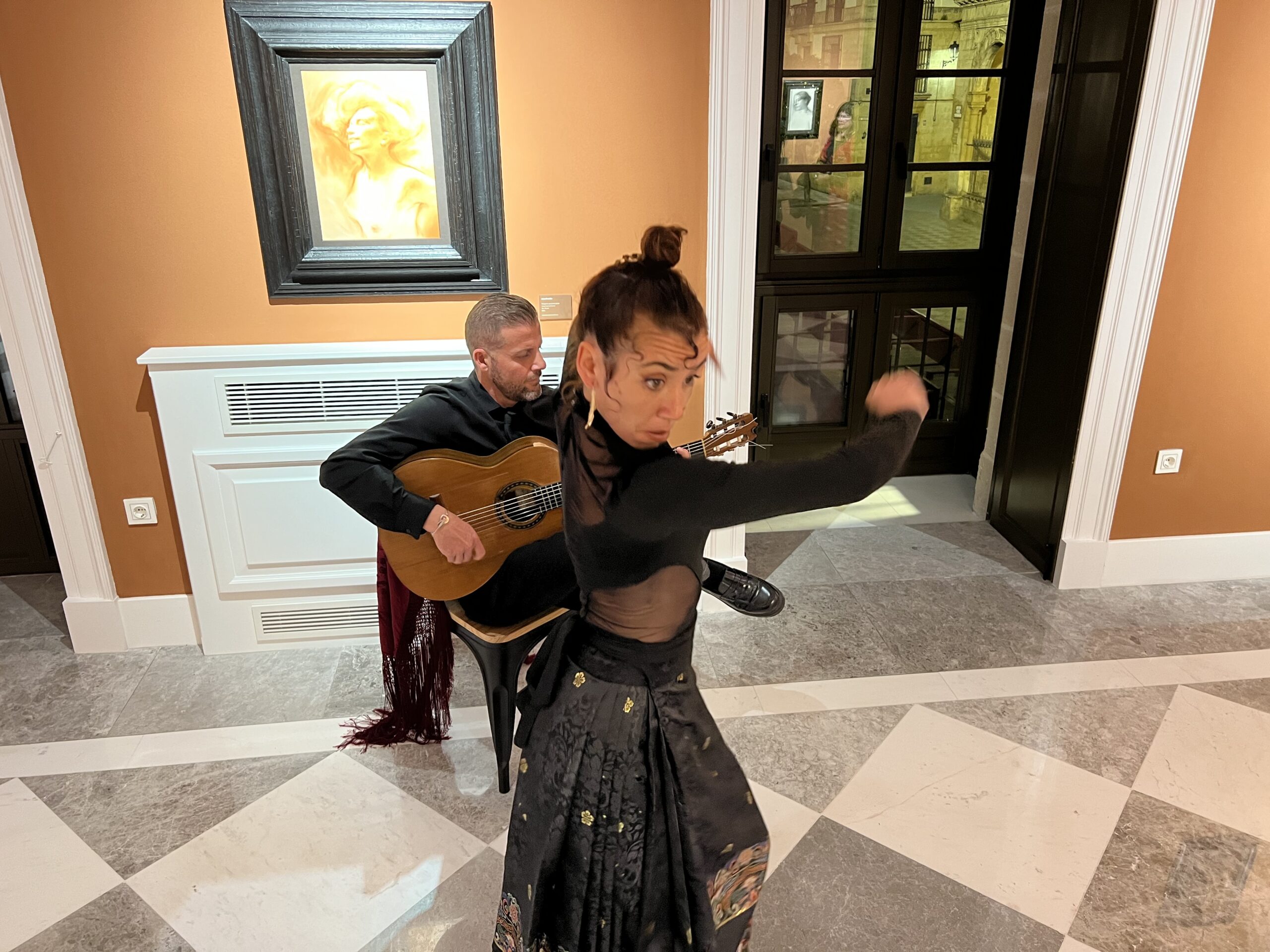 A flamenco dancer performs beside a seated guitarist during Chaz Chambers’ Spain research trip.