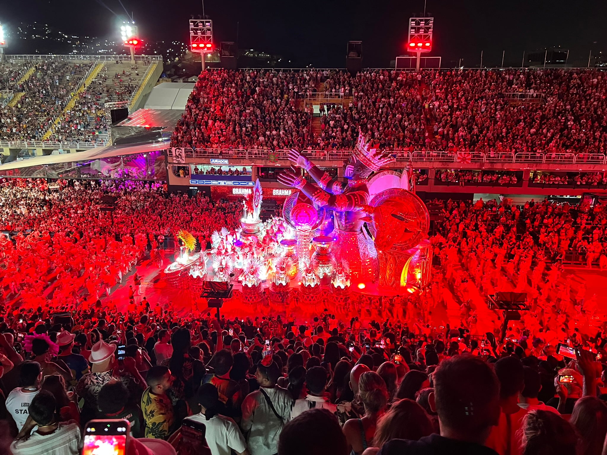 Illuminated samba school float and performers at the Sambadrome during Rio Carnival
